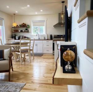 a kitchen with a table with a globe on it at Bambury's Hillside Chalets in Rocky Harbour