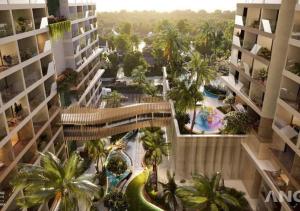 uma vista aérea de um edifício com piscina e palmeiras em The Song QA Apartment em Vung Tau