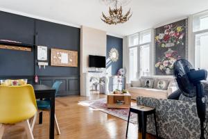 a living room with a couch and a table at Elegant apartment in Bordeaux at Les Chartrons in Bordeaux