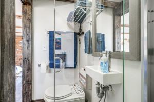 a bathroom with a toilet and a sink at Cozy Parowan Studio 12 Mi to Brian Head Resort! in Parowan
