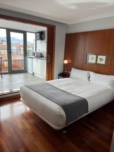 Postel nebo postele na pokoji v ubytování Hotel Gran Regente