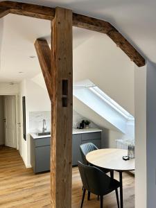 a kitchen and dining room with a table and a sink at Schickes Studio in bester Lage in Bad Salzuflen