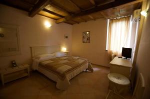 Ένα ή περισσότερα κρεβάτια σε δωμάτιο στο Villaggio Paradosso