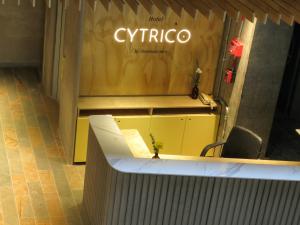 an office with a desk and a sign that reads cyprus at Hotel Cytrico in Medellín