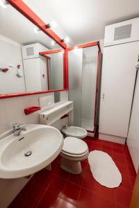 a bathroom with a white sink and a toilet at Erikzang - Cervinia Ski in Ski out Apartments in Breuil-Cervinia +51 photos