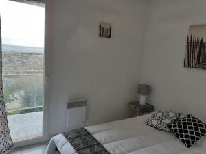 Posteľ alebo postele v izbe v ubytovaní VILLA Face à la Mer Sur le Sable 6 CLIM A L'ETAGE + 4 fotografie