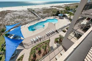 an aerial view of a swimming pool and the beach at Phoenix East II 2044 in Orange Beach