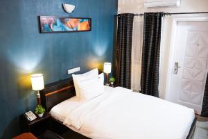 Ліжко або ліжка в номері EKA ELITE HOTEL