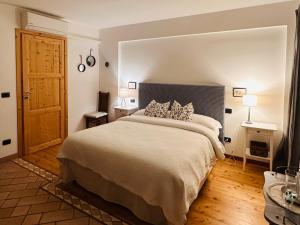 A bed or beds in a room at Relais Valpolicella B&B