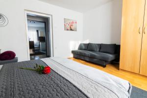 Postel nebo postele na pokoji v ubytování Apartma Ella