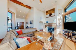 a living room with a couch and a fireplace at Mountain Range Manor in Eagle