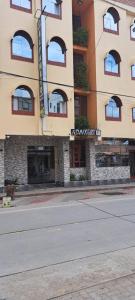 an empty street in front of a building at Hotel Alpamayo Guest House in Huaraz