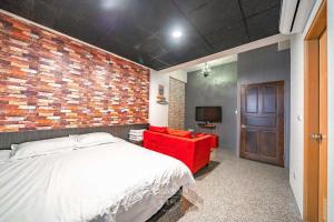Katil atau katil-katil dalam bilik di 羅東夜市 工業Loft旅宿