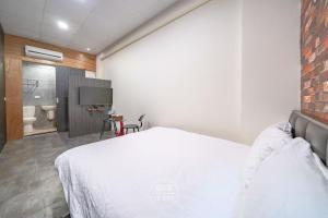 Katil atau katil-katil dalam bilik di 羅東夜市 工業Loft旅宿