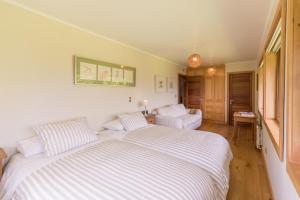 Postel nebo postele na pokoji v ubytování B&B Puerto Varas Playa Venado