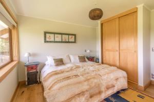 Postel nebo postele na pokoji v ubytování B&B Puerto Varas Playa Venado