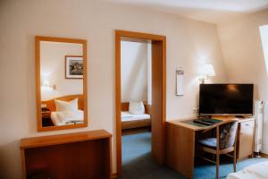TV a/nebo společenská místnost v ubytování Gasthof Hummel Hotel