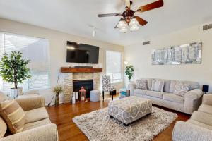 a living room with a couch and a fireplace at Mesa Resort in Leisure World