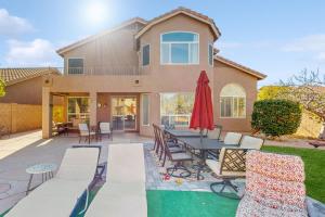 a house with a patio with a table and chairs at Mesa Resort in Leisure World