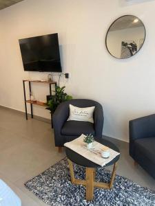 Μια τηλεόραση ή/και κέντρο ψυχαγωγίας στο Departamento PREMIUM Con mini pileta y parrilla compartida En la mejor ubicación de Junín