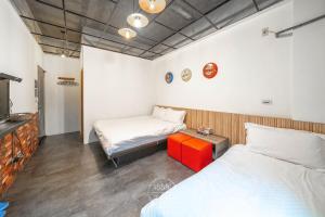 Katil atau katil-katil dalam bilik di 羅東夜市 工業Loft旅宿
