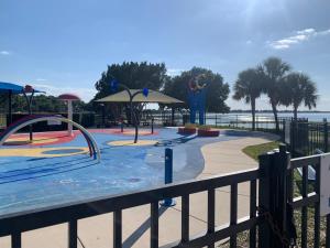 a water park with a pool and a playground at Pet friendly tiny house, No extra fees! in Clermont