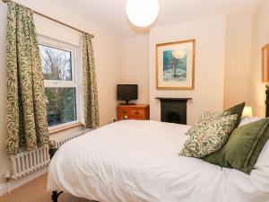 Ένα ή περισσότερα κρεβάτια σε δωμάτιο στο 6 Melinda Cottage