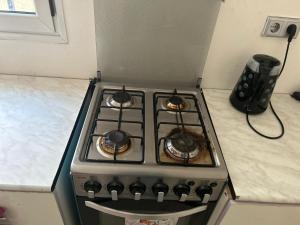 a stove top oven sitting in a kitchen at Marong Na kordaa in Sere Kunda