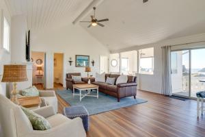 a living room with a couch and a table at Scenic Bandon Vacation Rental with Beach Access! in Bandon