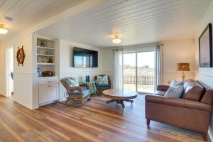 a living room with a couch and a table at Scenic Bandon Vacation Rental with Beach Access! in Bandon