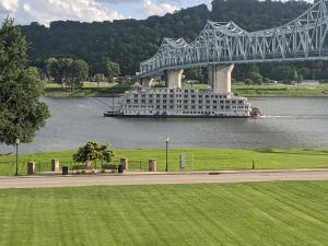 a boat on the water under a bridge at Riverboat Inn & Suites in Madison