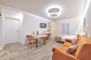 a living room with a couch and a table at FORESTERIA GUESTHOUSE CA' DEI BACHITT in Lierna