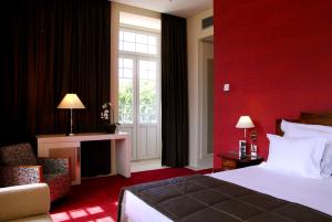 Postel nebo postele na pokoji v ubytování Curia Palace Hotel & Spa