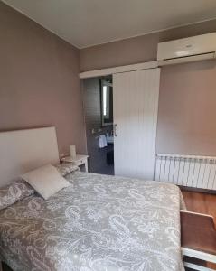A bed or beds in a room at Apartment Sant Francesc