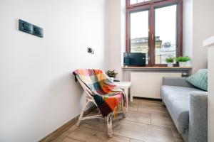 Posezení v ubytování Piotrkowska Studio with Mezzanine