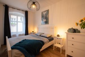 Кровать или кровати в номере Apartament Radków/Góry Stołowe/Kotlina Kłodzka