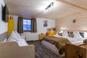 Postel nebo postele na pokoji v ubytování Kummererhof