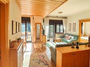 a living room with a couch and a table at Casa Sappada Appartamento in Sappada