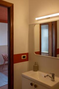 a bathroom with a sink and a mirror at Agriturismo Ca' Pasquin in Roccaverano