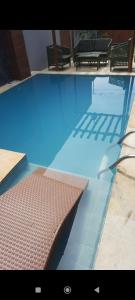 CórguinhoにあるCasa Parque Minasの- スイミングプール(ベッド1台付)