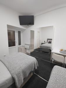 Voodi või voodid majutusasutuse Apartman Centar Ivanjica toas