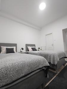 Voodi või voodid majutusasutuse Apartman Centar Ivanjica toas