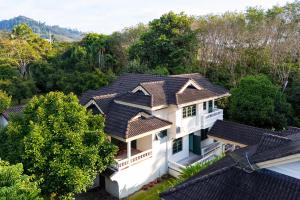 an aerial view of a house with roofs at Bann Mangkud Khaolak in Khao Lak