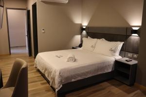 Voodi või voodid majutusasutuse Giluxe Hotel toas