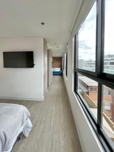 Voodi või voodid majutusasutuse Hermosa Vista en Chapinero cómodo wifi toas