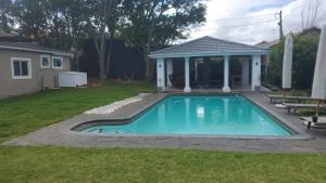 a swimming pool in the yard of a house at 1211 On Bluff in Durban