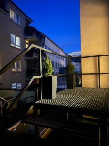 a balcony with a table and a potted plant on it at Alt Ap in Wuppertal