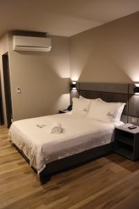 Voodi või voodid majutusasutuse Giluxe Hotel toas
