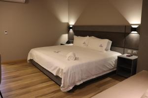Voodi või voodid majutusasutuse Giluxe Hotel toas