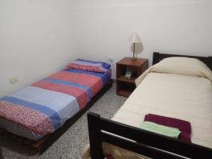 Voodi või voodid majutusasutuse Azul GUIDO SPANO toas